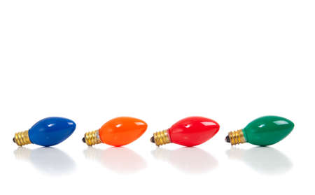 A group of Christmas light bulbs on a white background with copy spaceの写真素材