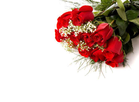 A boquet or red roses on a white background with copy spaceの写真素材
