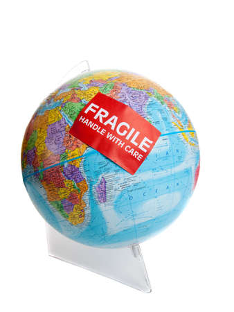 Earth globe with a red fragile sticker on a white backgroundの写真素材