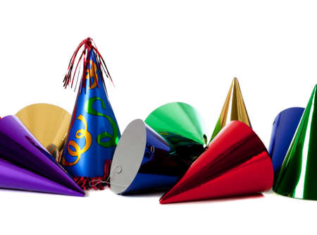 Group of colorful birthday party hats on white background with copy spaceの写真素材