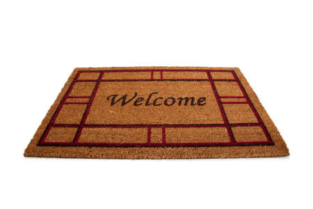 A mat or carpet with the word "Welcome" printed on it.  Hospitalityの写真素材