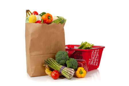 A grouping of fresh produce including fruits and vegetables in a grocery bag or sack with copy spaceの写真素材