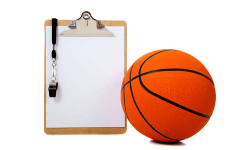 A basketball coach's clipboard with basketball and whistle on white background with copy spaceの写真素材