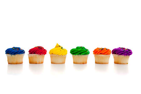 Multi colored cupcakes on white backgroundの写真素材