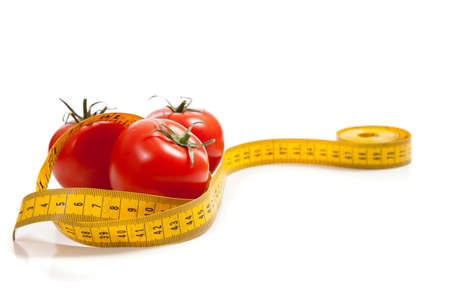 a tomato with a tape measureの写真素材