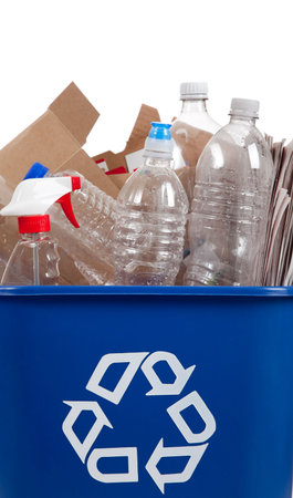 A recycle bin with recyclable item in it including bottles and boxes