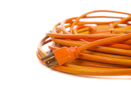 An orange extension cord on a white backgroundの写真素材