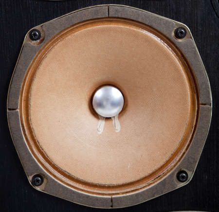 A vintage stereo speaker with no cover on a white backgroundの写真素材