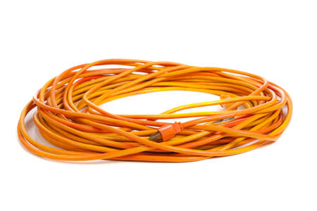 An orange extension cord on a white backgroundの写真素材