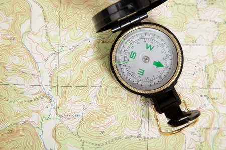 Compass laying on a topographical mapの写真素材