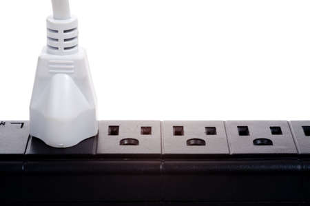 a black power strip with empty outlets on a white backgroundの写真素材