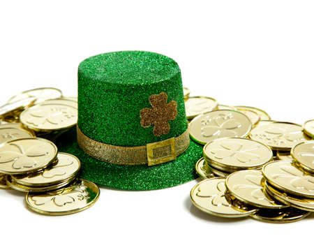 A group of St. Patricks Day decoations with a leprchaun hat and gold coinsの写真素材