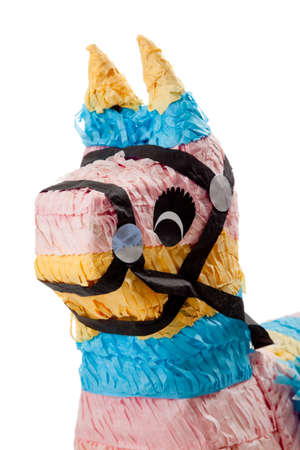 A pink, blue and yellow burro pinata on a white backgroundの写真素材