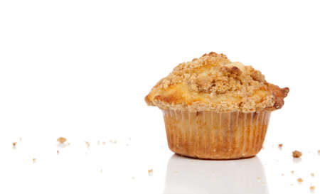 A Cinnamon struesel muffin on a cutting boardの写真素材