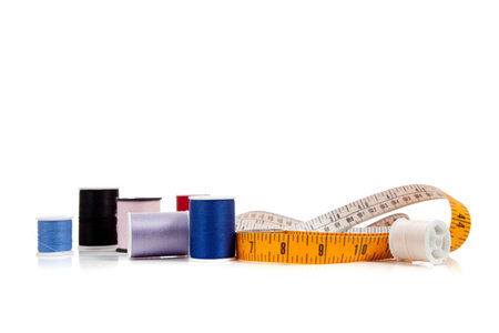 A yellow tape measure on a white background