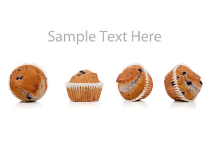 a row of blueberry muffins on a white background with copy spaceの写真素材