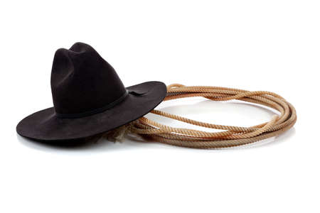 A Black cowboy hat and lasso on a white background with copy spaceの写真素材