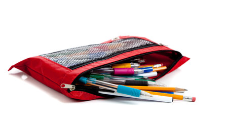 Red pencil bag including pens, pencils and gel pens on a white background