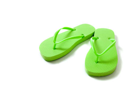 Green flipflops on a white backgroundの写真素材