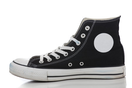 One black retro high top sneaker on a white backgroundの写真素材