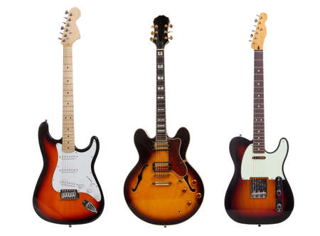 A group of three electric guitars on a white backgroundの写真素材