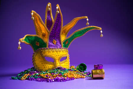 Festive Grouping of mardi gras, venetian or carnivale mask on a purple backgroundの写真素材