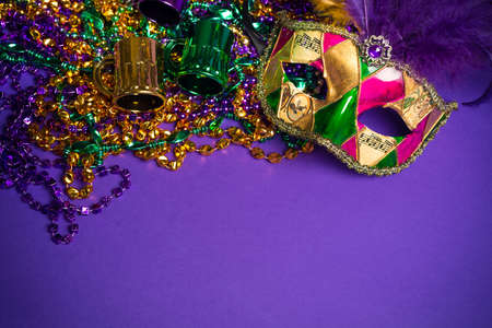 Festive Grouping of mardi gras, venetian or carnivale mask on a purple backgroundの写真素材
