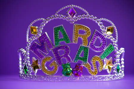 A colorful mardi gras crown on a purple backgroundの写真素材