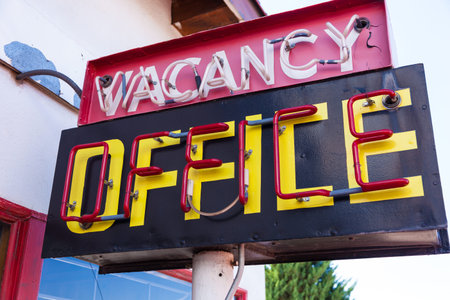A retro neon vacancy office hotel sign