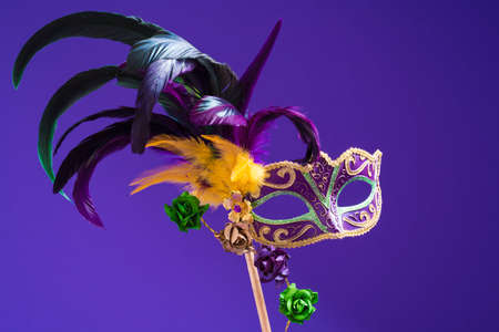 Mardi Gras or carnival mask on bright purple backgroundの写真素材