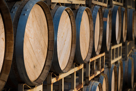 A stack of wine barrels at a vineyard