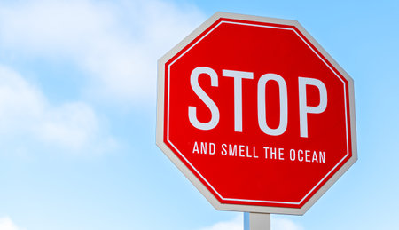 A stop and smell the ocean traffic, street sign in southern California