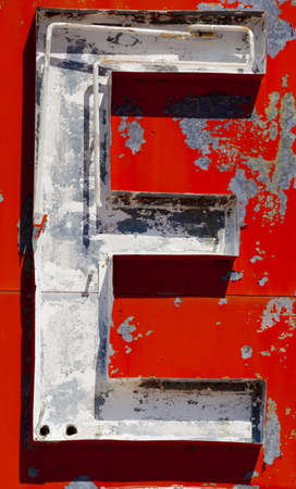 Vintage letter "E" on a antiquque, neon signの写真素材
