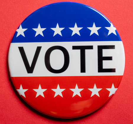 Vote buttons on red background with copy space. Election theme