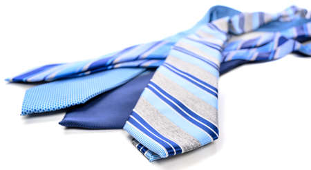 A group of blue neckties on a white backgroundの写真素材