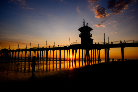 Sunset at Huntington Beach pier in Californiaの写真素材