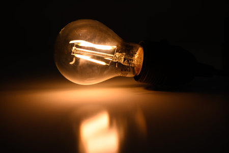 LED light bulb on a warm background