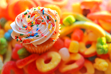 Delicious desert, colorful cupcakes with a variety of frosting flavorsの写真素材