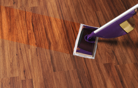 Modern mop for cleaning wooden floor from dust, cleaning serviceの写真素材