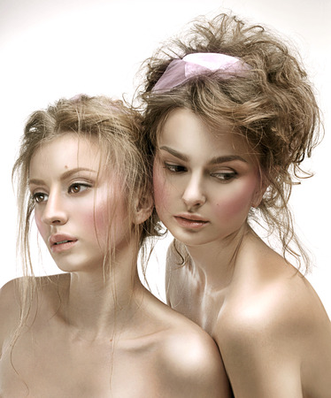 Beautiful face woman with fresh daily makeup. Beauty Portrait of model with shiny skin, and romantic wavy hair.の写真素材