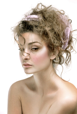 Beautiful face woman with fresh daily makeup. Beauty Portrait of model with shiny skin, and romantic wavy hair.の写真素材