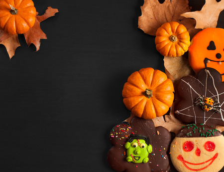 Halloween homemade gingerbread cookies on wooden background, autumn moodの写真素材