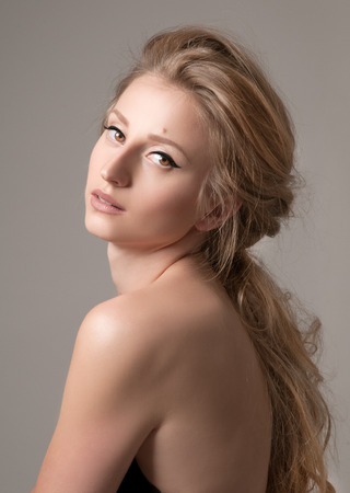 Beautiful face of young woman with perfect and fresh skinの写真素材