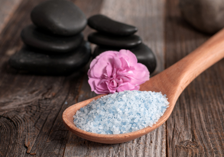 Spa and wellness setting with sea salt and stones for massage. の写真素材