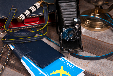 Travel.  Air ticket, globe  and bag on wood backgroundの写真素材