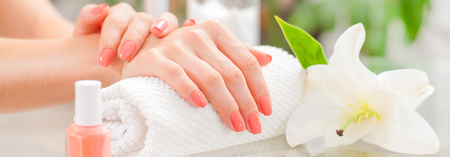 Manicure concept. Hand care at the spa. Beautiful woman's hands with perfect manicure at  beauty salon.の写真素材