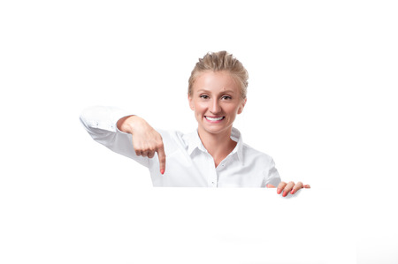 Woman is pointing at a subscription button down belowの写真素材