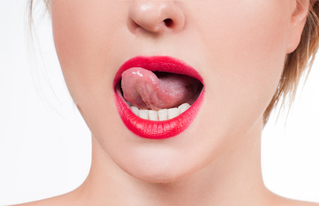 White teeth and red lips. Perfect female smile after bleaching. Dental care and whitening teeth.の写真素材