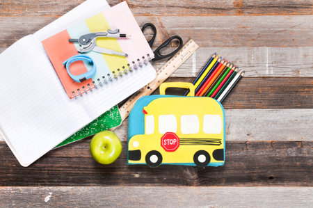 School supplies on wooden background. Back to school