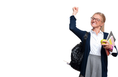 Happy young student girl holding books, high school or college graduand, standing isolated on white background. Back to schoolの写真素材
